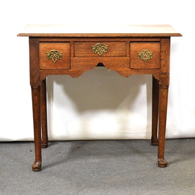 Lot 353 - George III oak lowboy