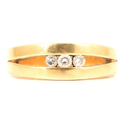 Lot 84 - A diamond three stone ring.