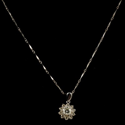 Lot 175 - A diamond cluster pendant and chain.