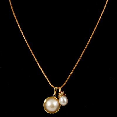 Lot 183 - A cultured pearl and diamond pendant and chain, another pearl pendant.