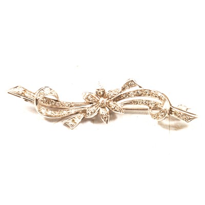 Lot 214 - A modern diamond set bar brooch.