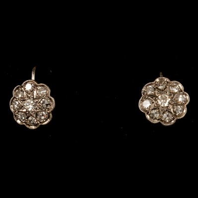 Lot 294 - A pair of diamond cluster flower head earscrews.
