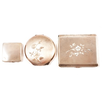 Lot 421 - Two silver powder compacts and a cigarette case.