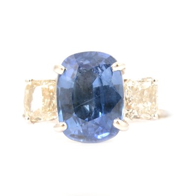 Lot 39 - A sapphire and diamond three stone ring.