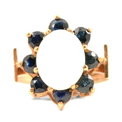 Lot 12 - A 1970’s opal and sapphire cluster ring.