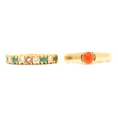 Lot 16 - An emerald and diamond half hoop ring and a fire opal solitaire ring.