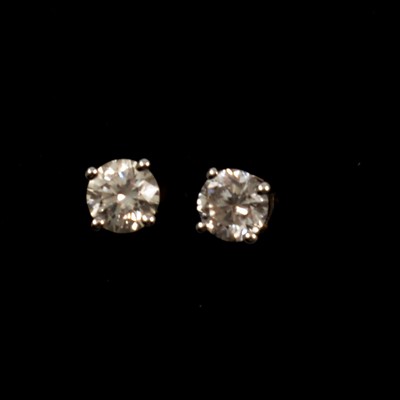 Lot 292 - A pair of diamond solitaire earstuds.