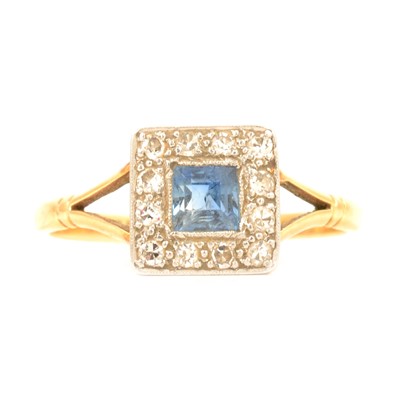 Lot 47 - A sapphire and diamond cluster ring.
