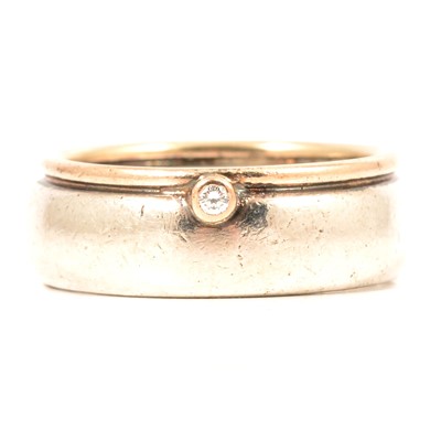 Lot 120 - Boodle & Dunthorne - a gentleman's silver and yellow metal diamond set ring.