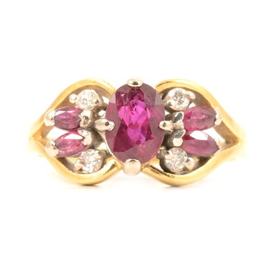 Lot 29 - A ruby and diamond cluster ring.