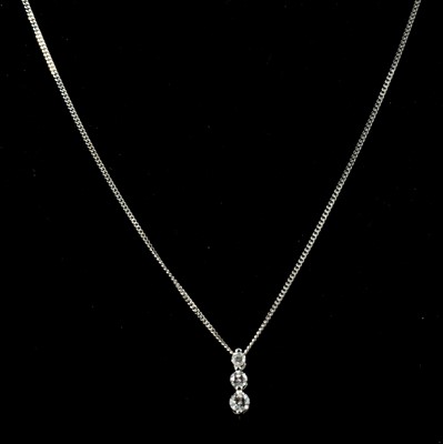 Lot 176 - A diamond pendant and chain.