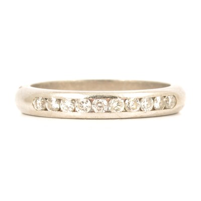 Lot 66 - A diamond half eternity ring.