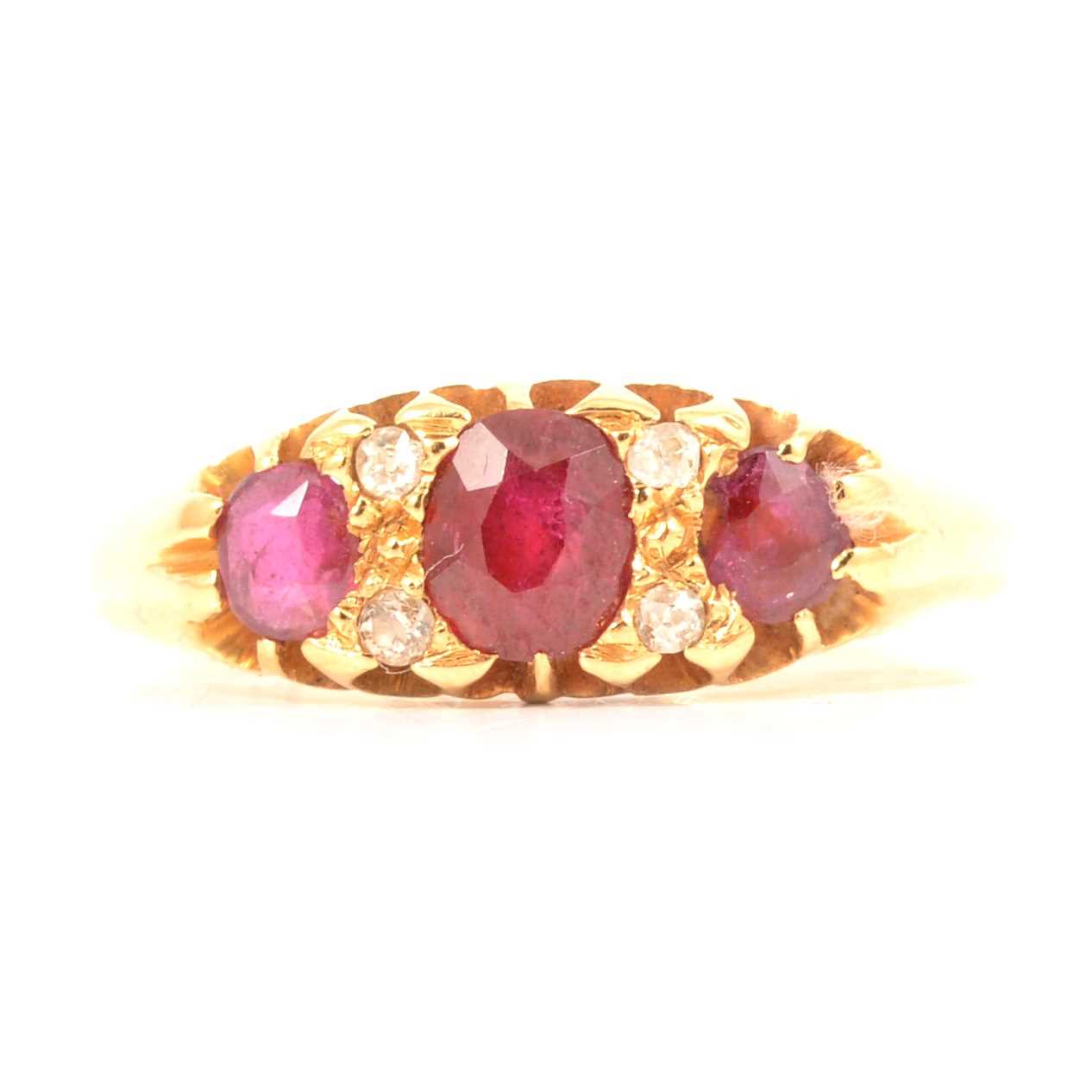 Lot 2 - A ruby and diamond half hoop ring.