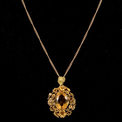 Lot 195 - A citrine pendant on a yellow metal chain.