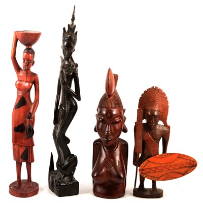 Lot 113 - A collection of African and Asian carved wooden figures, animals and masks.