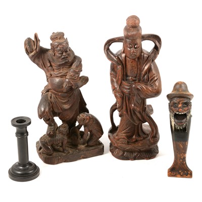 Lot 153 - Two carved Chinese figures, nutcracker, and ebony candlesticks