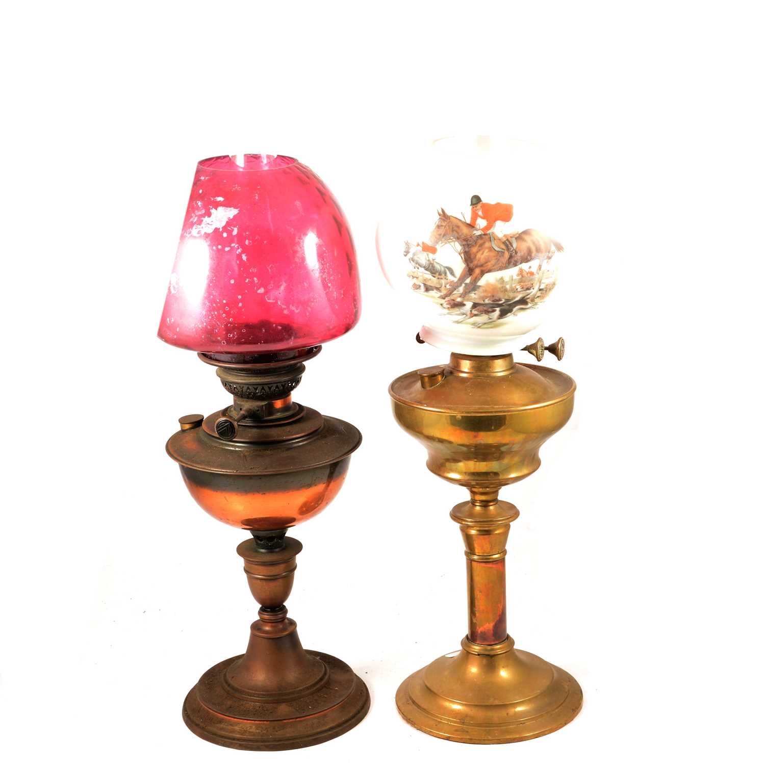 Lot 273 Two oil lamps, mantel clock and a metronome,