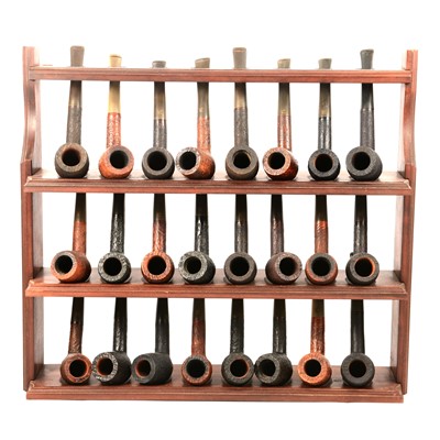 Lot 223 - A three shelf pipe club rack with St Claude pipes.