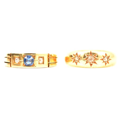 Lot 49 - A diamond three stone gypsy set ring and a sapphire and diamond ring.