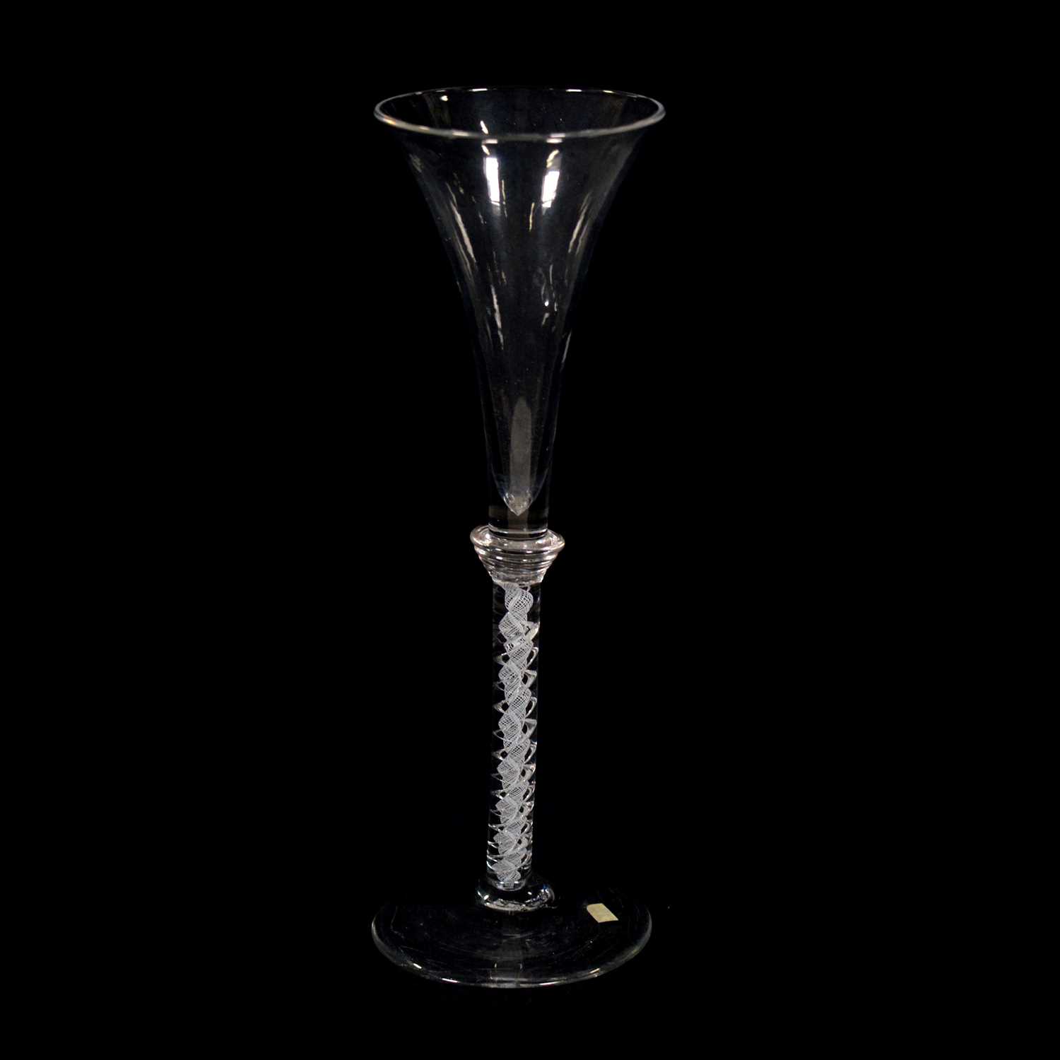 Lot 619 - Tall trumpet-shape flute, with mixed twist stem