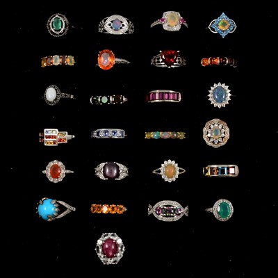 Lot 399 - Twenty-five gemset silver rings, emerald, opal, quartz, topaz and others.
