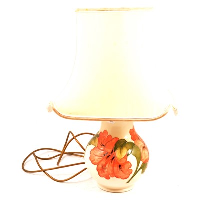 Lot 31 - Moorcroft Pottery - an Hibiscus pattern table lamp.