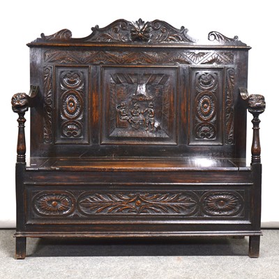 Lot 496 - Carved oak box seat settle, late 19th century