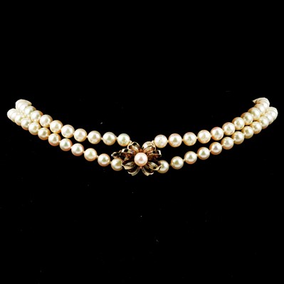 Lot 277 - A rope of cultured pearls with clasp.