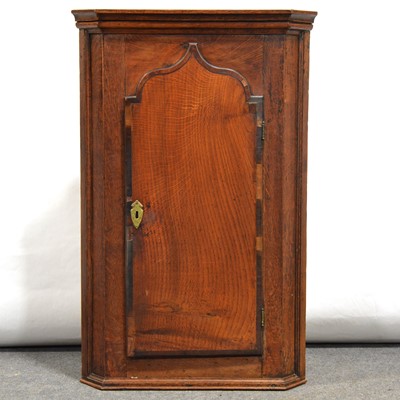 Lot 59 - George III oak and mahogany hanging corner cupboard