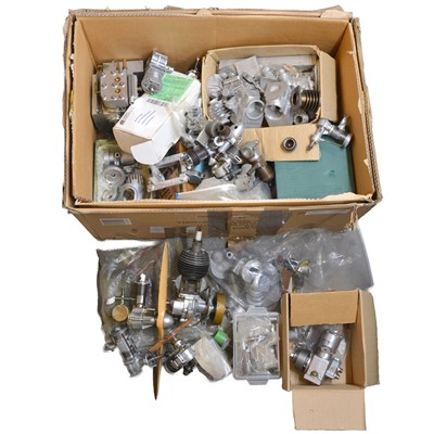 Lot 358 - A box of model engine parts and near-complete engines