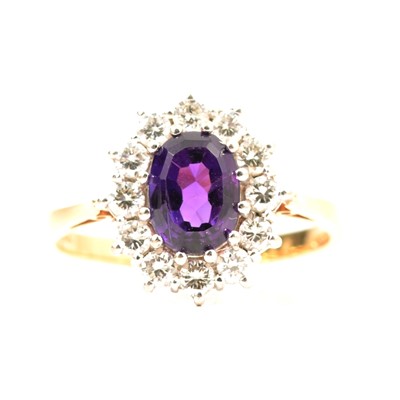 Lot 4 - An amethyst and diamond cluster ring.
