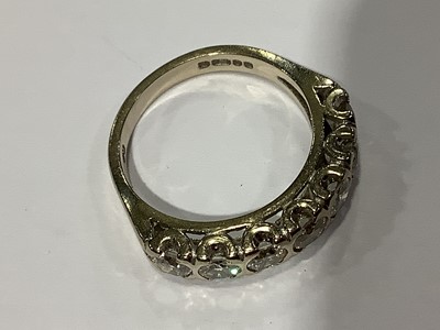 Lot 61 - A diamond half eternity ring.