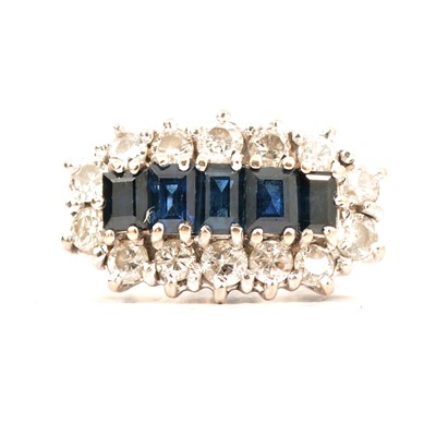 Lot 44 - A sapphire and diamond cluster ring.