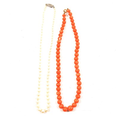 Lot 201 - A cultured pearl necklace and a coral bead necklace.