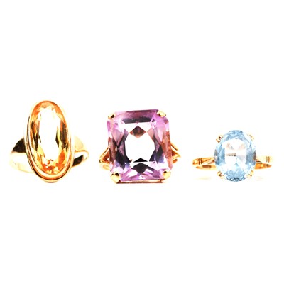 Lot 5 - Three gemset dress rings, amethyst, citrine and synthetic blue spinel.