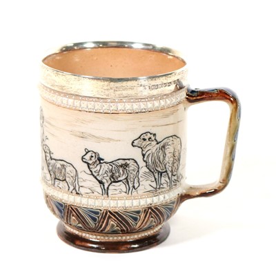 Lot 692 - Doulton Lambeth, a silver mounted stoneware tankard, incised by Hannah Barlow