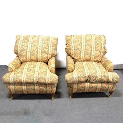 Lot 585 - Set of four modern Howard style easy chairs.