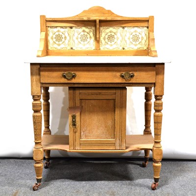 Lot 489 - Victorian oak marble-top washstand with tile back