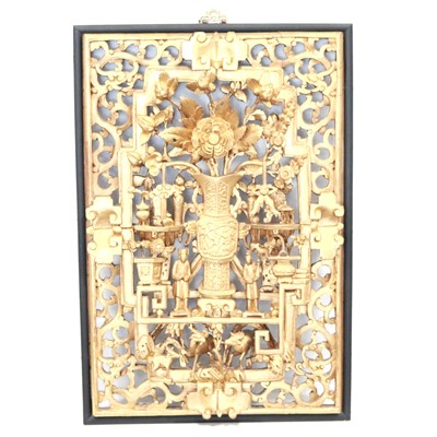 Lot 374 - A Japanese ornately carved and gilded framed panel.