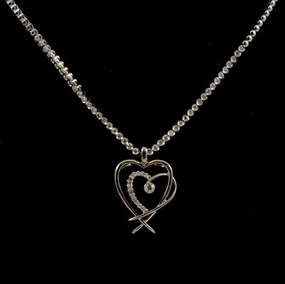 Lot 293 - A diamond necklace and double heart shape pendant.