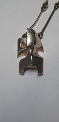 Lot 207 - Bjorn Weckstrom for Lapponia - a futuristic silver pendant and chain named "Zombi".