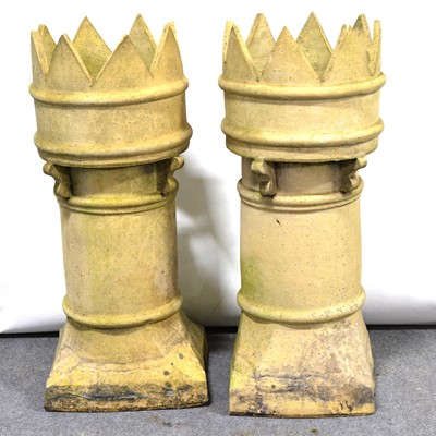 Lot 571 - Pair of terracotta castle top chimney pots, height 82cm.