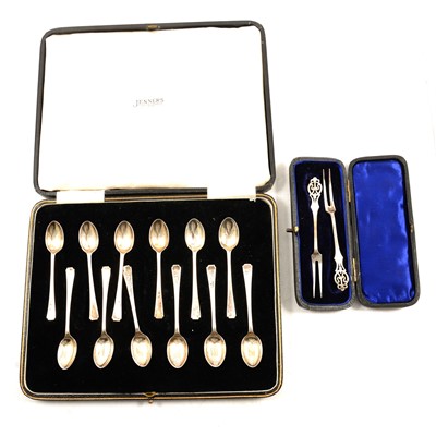 Lot 335 - Set of twelve silver egg spoons; a pair of silver pickle forks