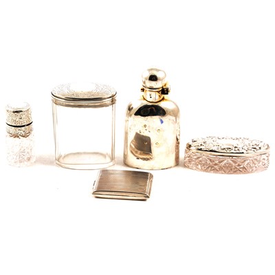 Lot 243 - A silver hip flask, salts bottle, two glass pots with silver covers.