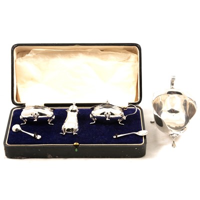 Lot 234 - A silver cased condiment set and a silver sauce boat.