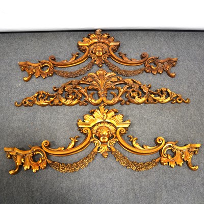 Lot 40 - Pair of gilt composition door pelmet decorations, and one similar