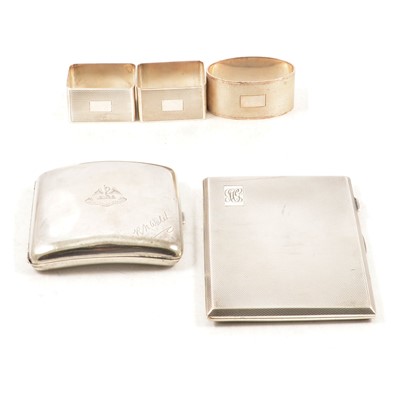 Lot 336 - Two silver cigarette cases and three napkin rings.