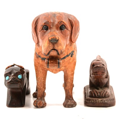 Lot 168 - Three carved wood novelty dog models