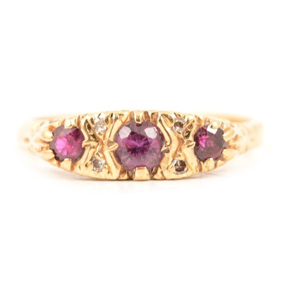 Lot 43 - A ruby and diamond half hoop ring.