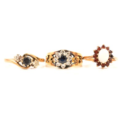 Lot 85 - Three gemset rings, sapphire and diamond, opal and garnet.